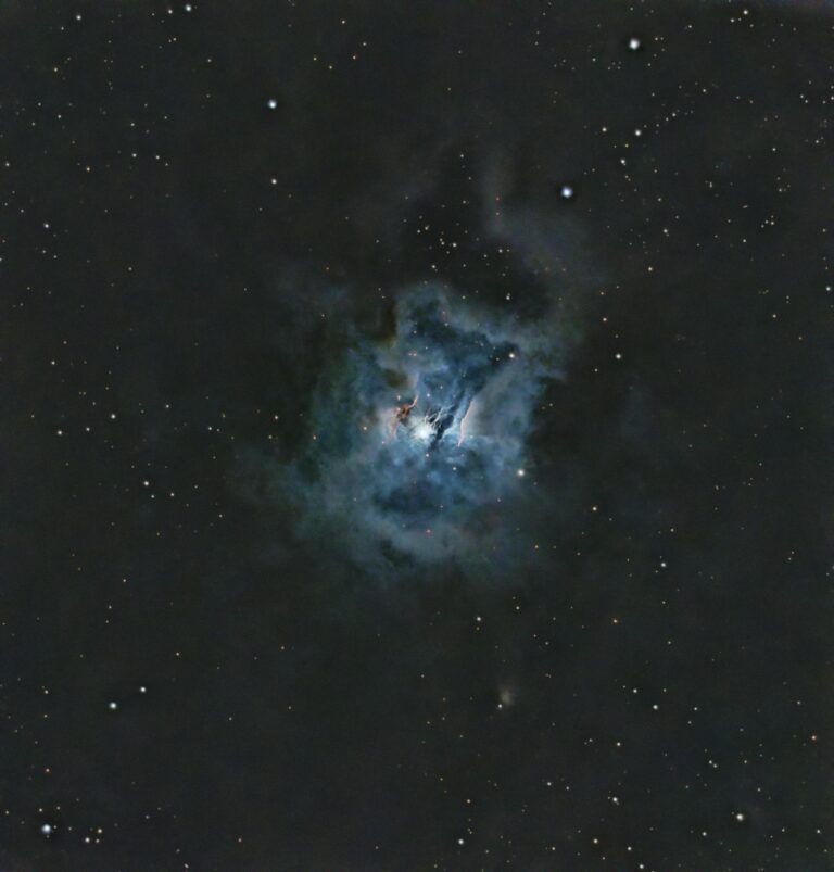A captivating image of a nebula surrounded by stars in the vast cosmos.