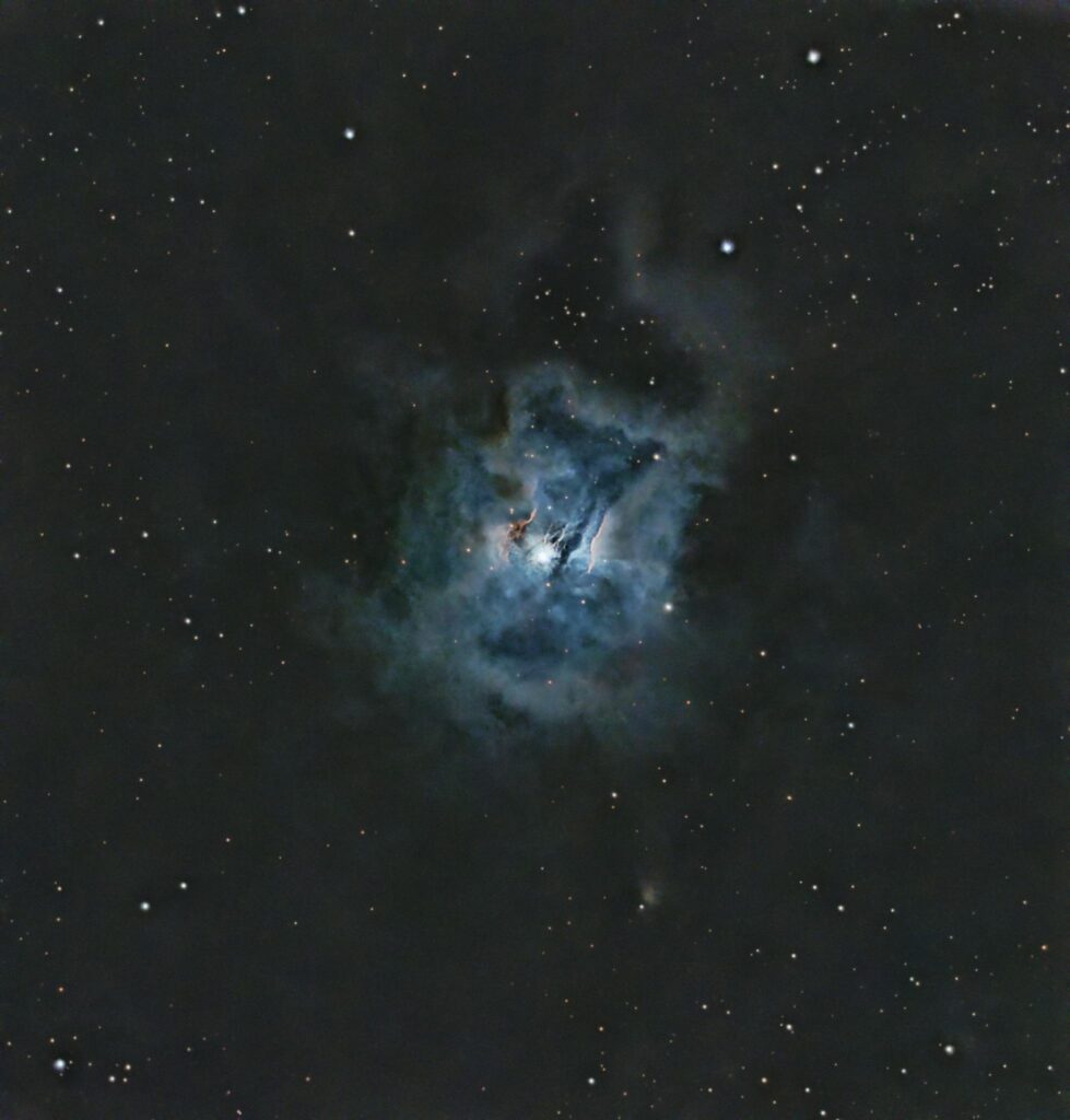 A captivating image of a nebula surrounded by stars in the vast cosmos.
