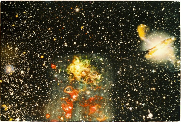 Colorful nebula and distant galaxy captured in a star-filled cosmic scene.